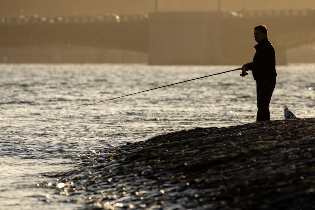 Angler fishing after rain