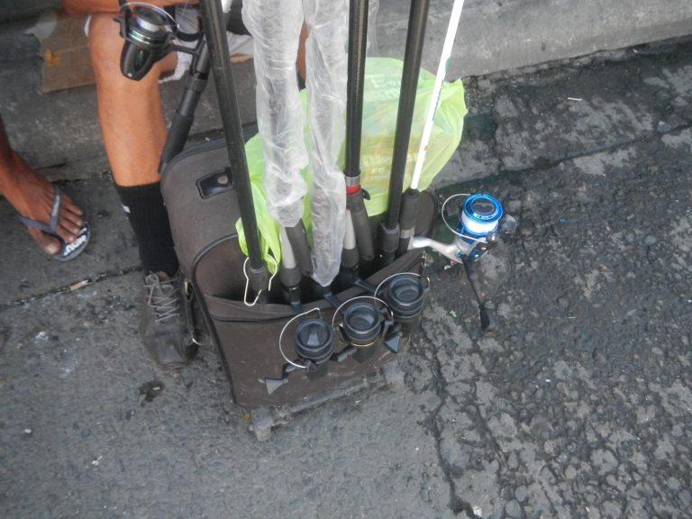 Fishing rod and tackle gear used with pliers and line cutters